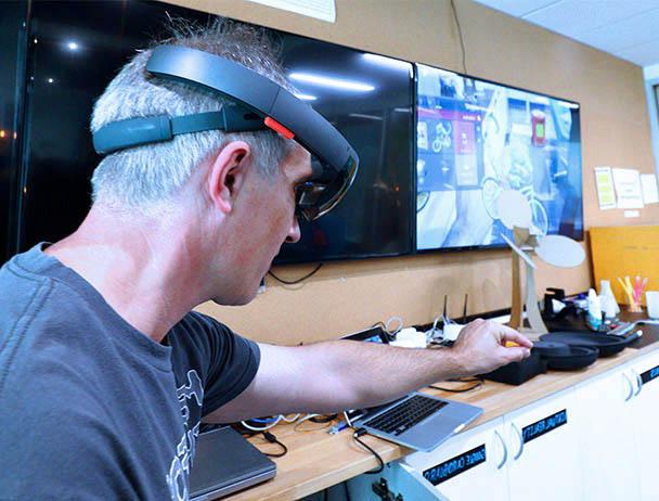 Viasat engineer tests out virtual equipment in a lab